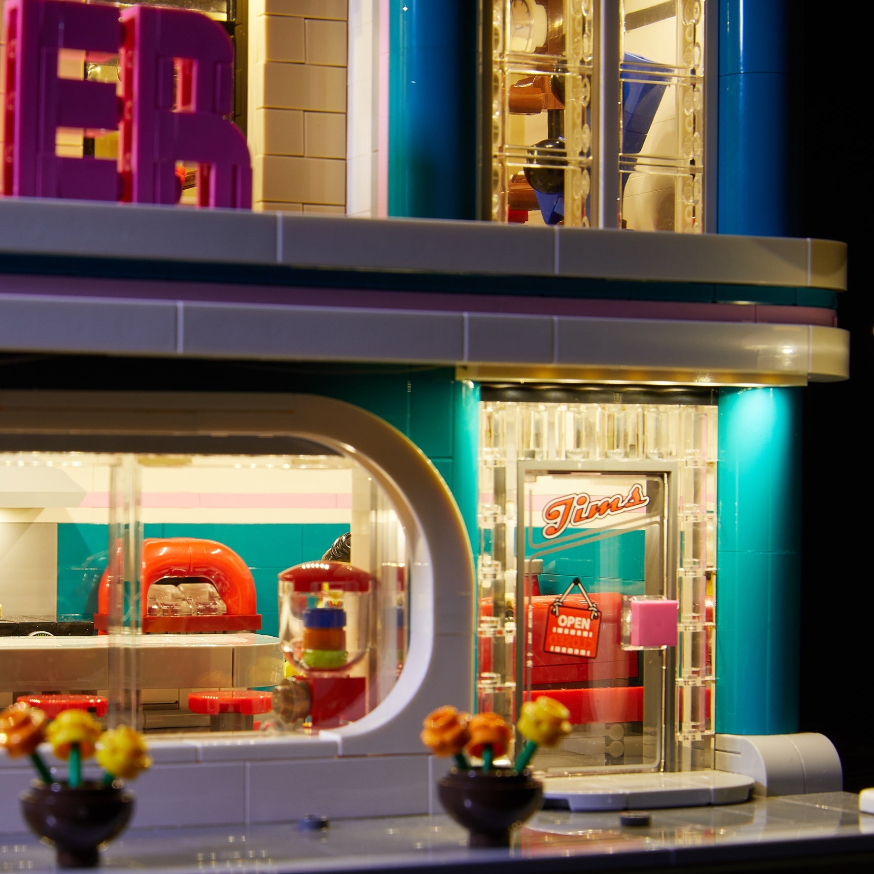 Close up of the LEGO Downtown Diner set 10260, brilliantly illuminated with the Brick Loot LED light kit!